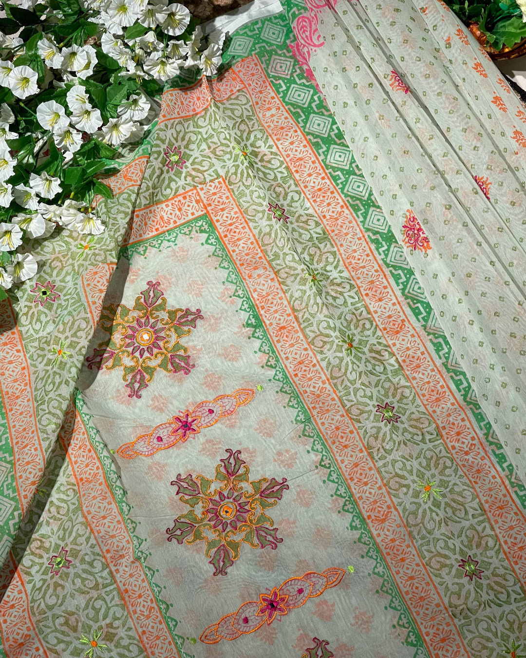 Decorative fabric with floral patterns and green leaves in the background