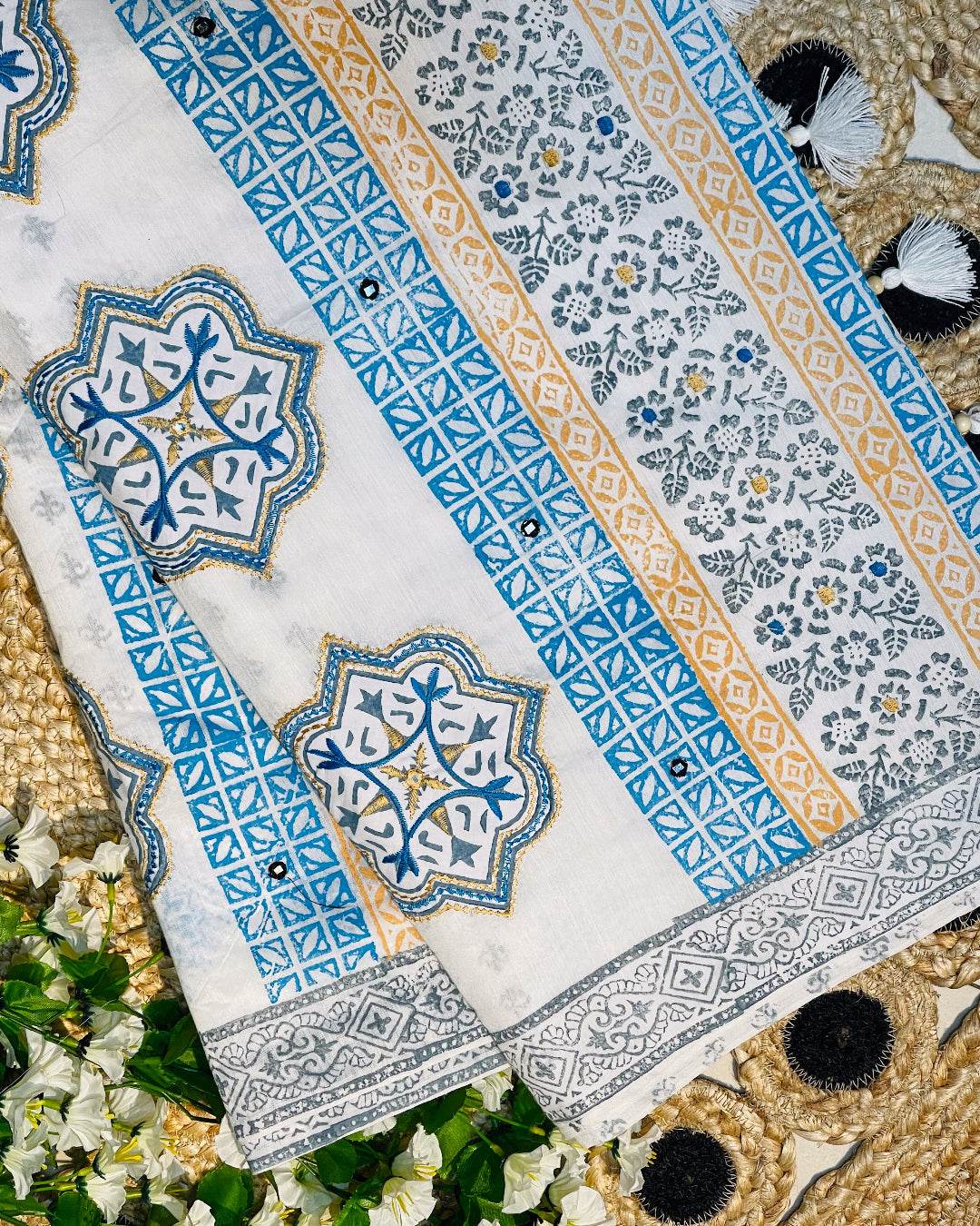Decorative tablecloth with intricate patterns on a floral and woven surface