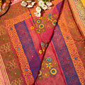 Decorative fabric with floral patterns and colorful borders on a yellow background