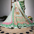 Traditional embroidered fabric with floral patterns on a woven surface
