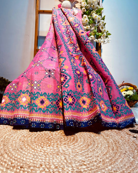 Colorful fabric draped over a chair with a blurred outdoor background