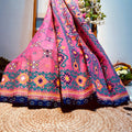 Colorful fabric draped over a chair with a blurred outdoor background