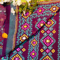 Colorful fabric with intricate patterns and floral elements