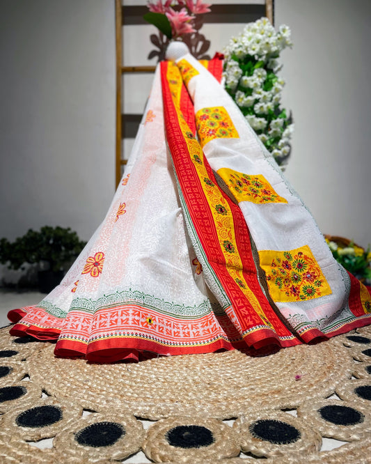 Colorful traditional fabric with floral patterns on a woven surface