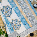 Decorative tablecloth with intricate patterns on a floral and woven surface
